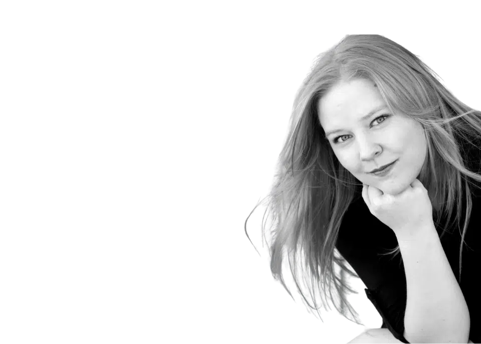 A black and white photo of a woman with long hair.