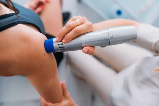 A person is holding an electric device in their hand.